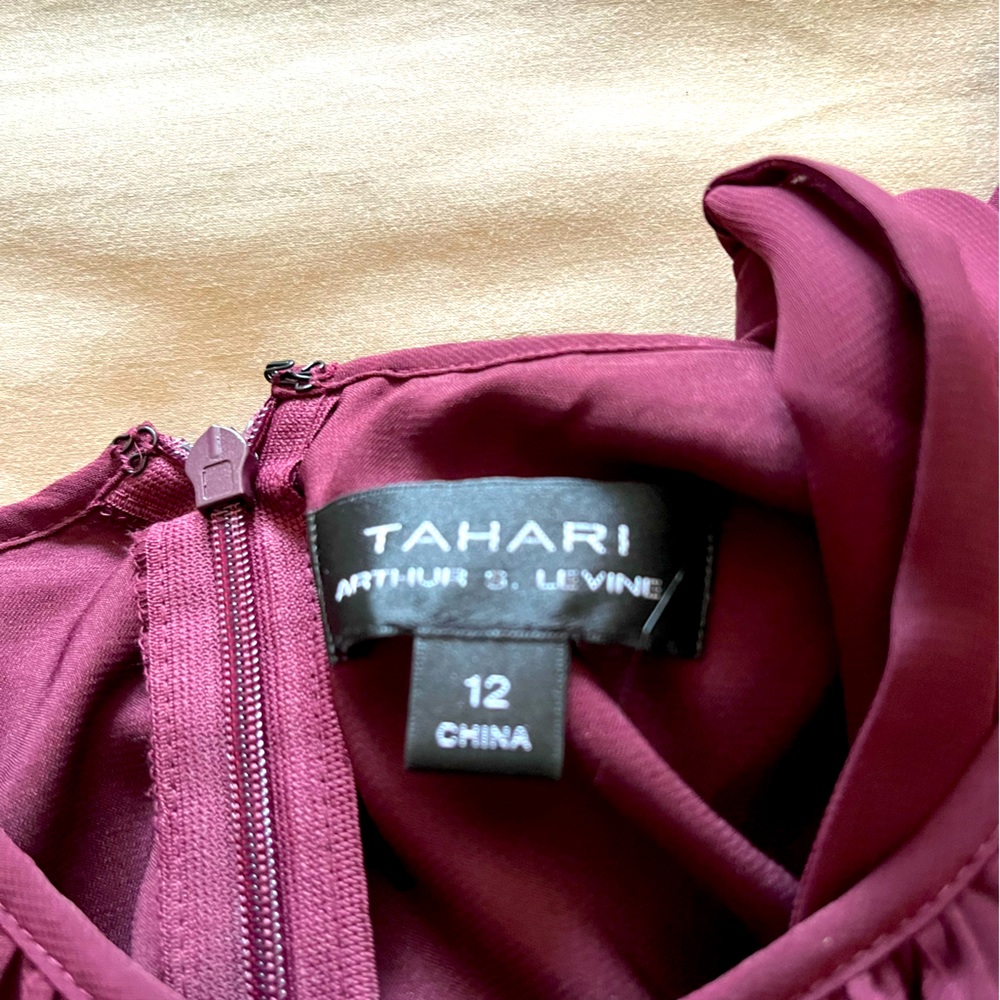 Wine colored mid length -same color belt - sample so no tags - never worn .